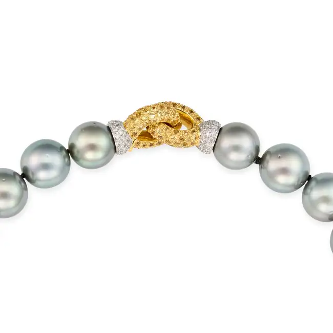 A FINE TAHITIAN PEARL, DIAMOND AND YELLOW SAPPHIRE NECKLACE comprising a single row of thirty one