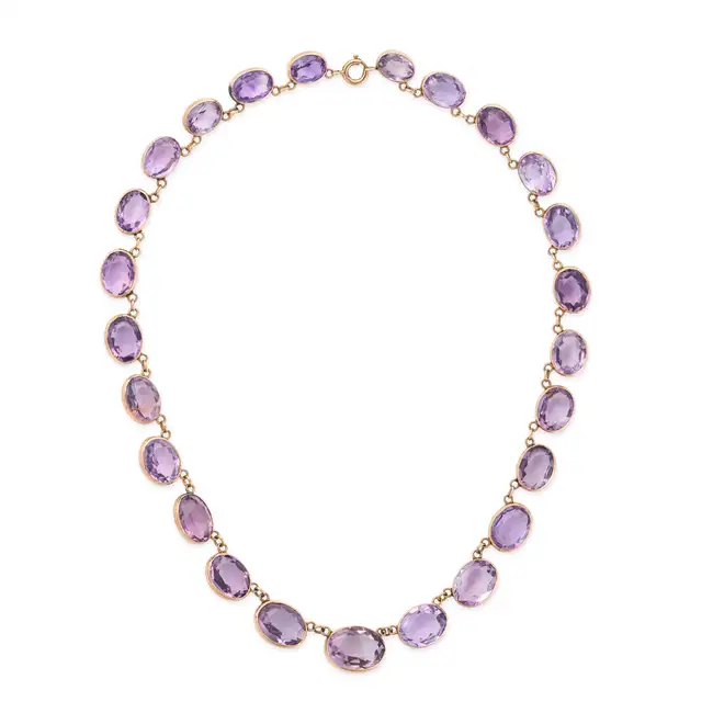 NO RESERVE - AN ANTIQUE AMETHYST RIVIERE NECKLACE, 19TH CENTURY in yellow gold, comprising a