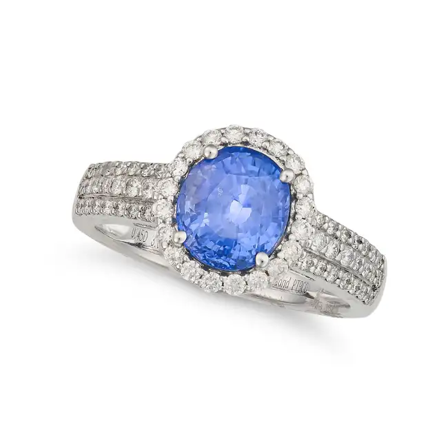 A CEYLON NO HEAT SAPPHIRE AND DIAMOND RING set with an oval cut sapphire of 3.05 carats in a