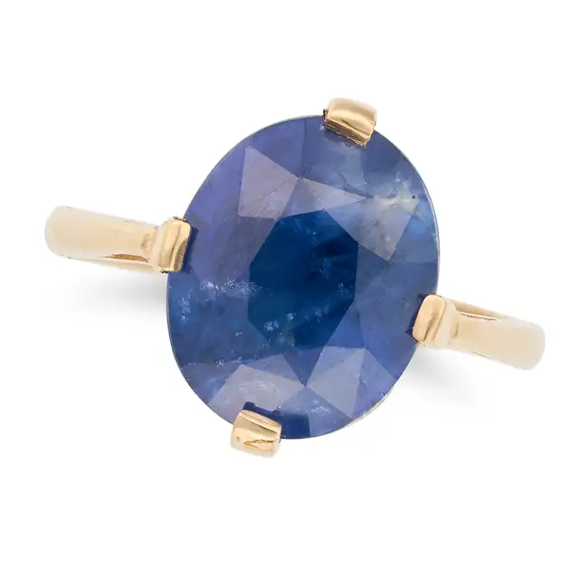 A SAPPHIRE RING set with an oval cut sapphire of approximately 7.21 carats, no assay marks, size L /