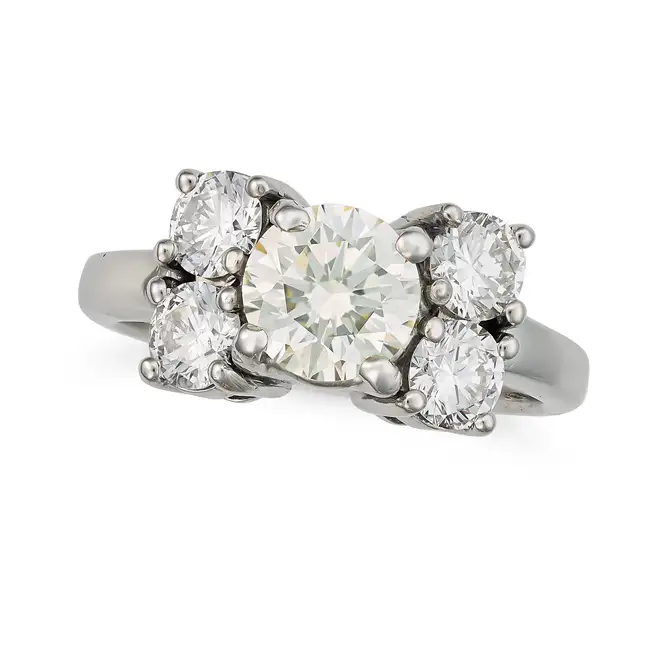 A DIAMOND DRESS RING set with a round brilliant cut diamond of approximately 1.15 carats, accented