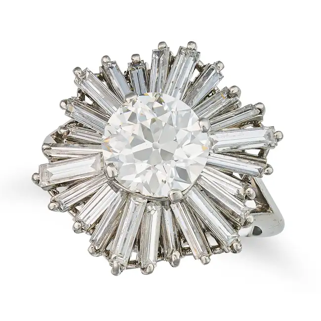 A FINE MID CENTURY DIAMOND BALLERINA RING set with an old cut diamond of approximately 2.16