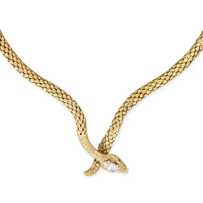 A FINE VINTAGE DIAMOND AND EMERALD SNAKE NECKLACE in 14ct yellow gold, designed as a snake, the head