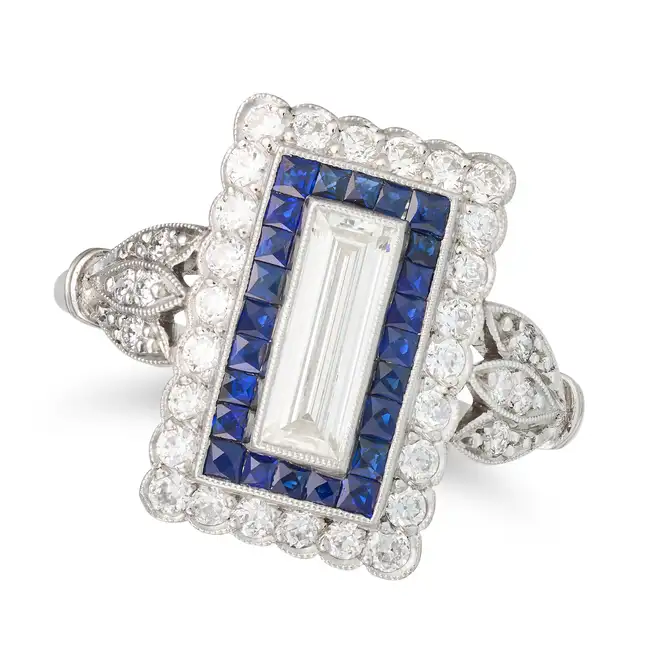 AN ART DECO DIAMOND AND SAPPHIRE DRESS RING, EARLY 20TH CENTURY in platinum, set with a baguette cut