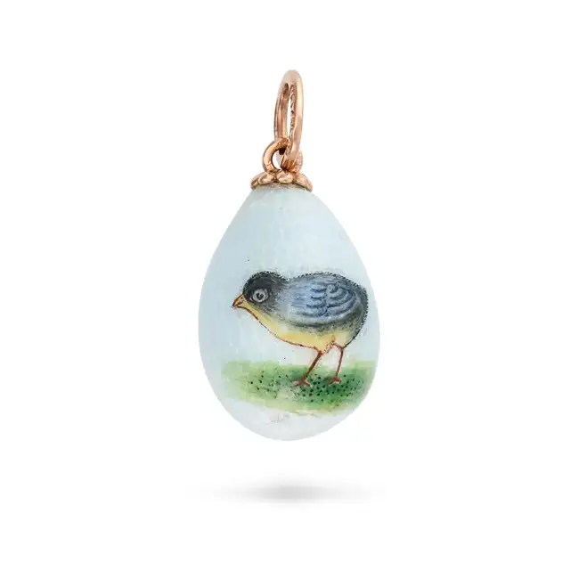 A RUSSIAN BLUE ENAMEL CHICK EGG PENDANT the egg shaped pendant relieved in light blue enamel,