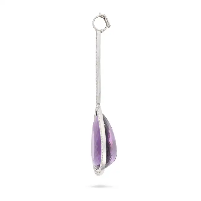 NO RESERVE - AN AMETHYST AND DIAMOND PENDANT in white gold, set with a pear cut amethyst of