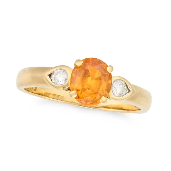 NO RESERVE - A SPESSARTINE GARNET AND DIAMOND RING in 18ct yellow gold, set with an oval cut