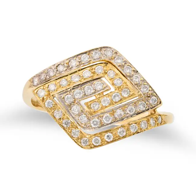 NO RESERVE - A DIAMOND DRESS RING in 18ct white and yellow gold, the stylised ring set with round