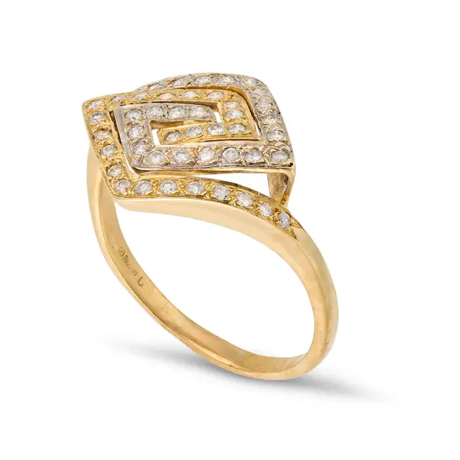 NO RESERVE - A DIAMOND DRESS RING in 18ct white and yellow gold, the stylised ring set with round