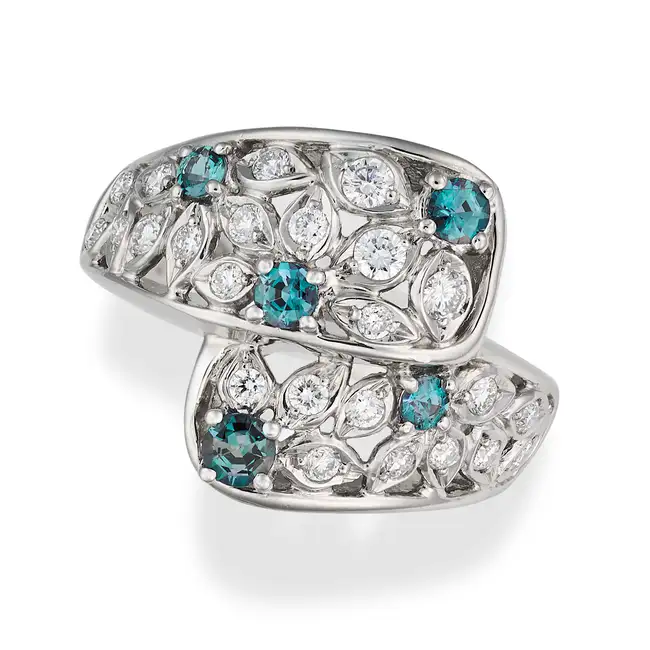 A FINE ALEXANDRITE AND DIAMOND DRESS RING the crossover ring in openwork foliate design, set with
