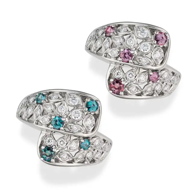 A FINE ALEXANDRITE AND DIAMOND DRESS RING the crossover ring in openwork foliate design, set with