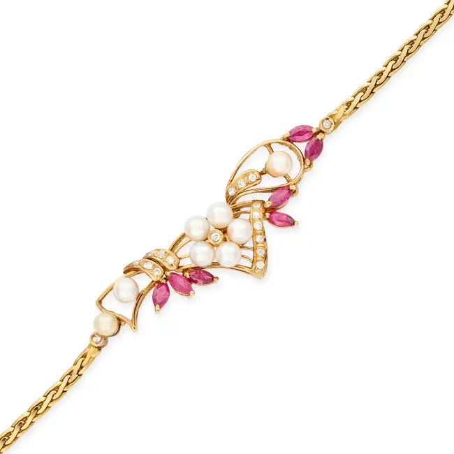 NO RESERVE - A RUBY, PEARL AND DIAMOND BRACELET in 18ct yellow gold, in foliate design, set with a