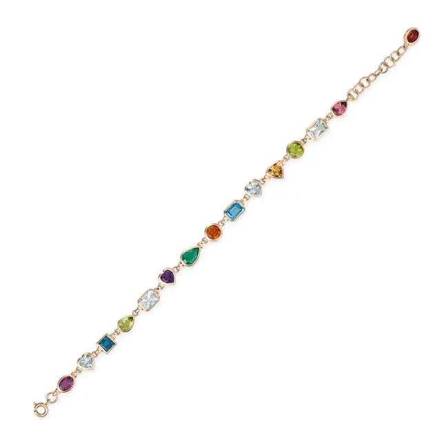 A MULTI GEM BRACELET comprising a row of oval, heart, square step, pear, octagonal step, round and