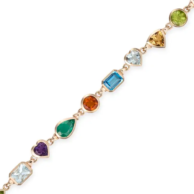 A MULTI GEM BRACELET comprising a row of oval, heart, square step, pear, octagonal step, round and