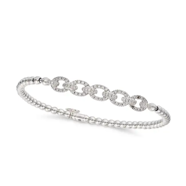 HULCHI BELLUNI, A FLEXIBLE DIAMOND BRACELET in 18ct white gold, comprising a row of oval links set