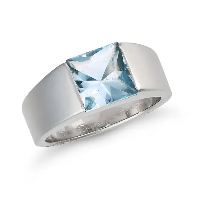 CARTIER, AN AQUAMARINE TANK RING, 1999 in 18ct white gold, set with a buff top aquamarine of