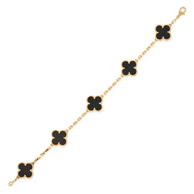VAN CLEEF & ARPELS, AN ONYX VINTAGE ALHAMBRA BRACELET in 18ct yellow gold, comprising five