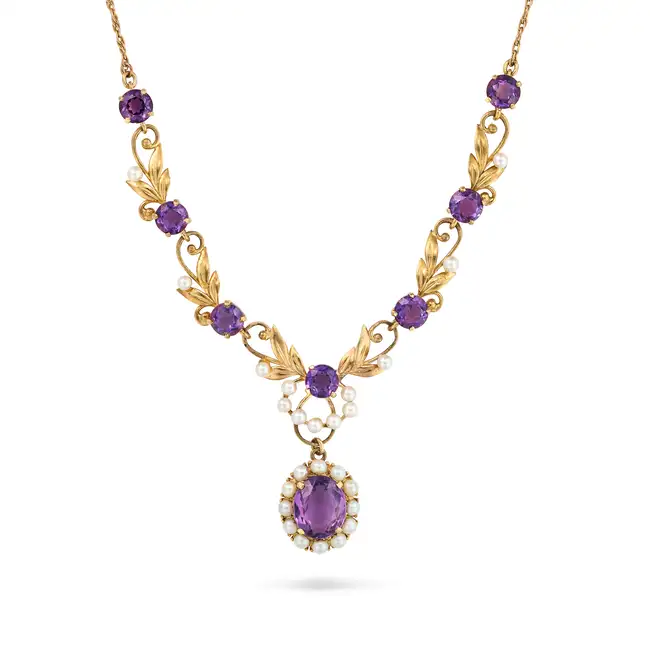 A VINTAGE AMETHYST AND PEARL NECKLACE in 9ct yellow gold, the necklace in foliate design, set with