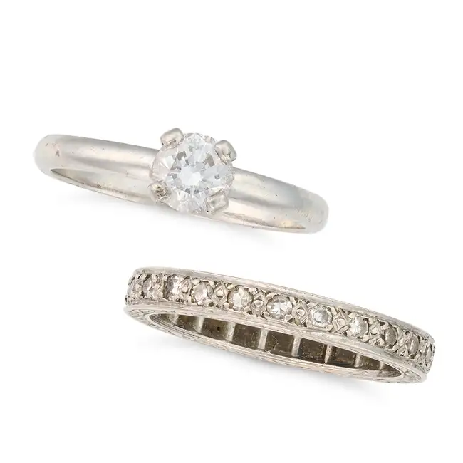 NO RESERVE - A DIAMOND SOLITAIRE RING AND DIAMOND ETERNITY RING the solitaire set with a round