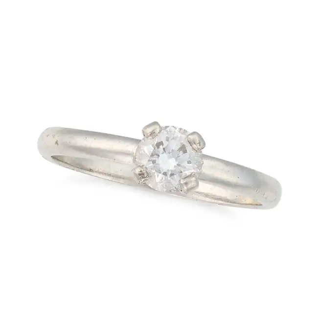 NO RESERVE - A DIAMOND SOLITAIRE RING AND DIAMOND ETERNITY RING the solitaire set with a round