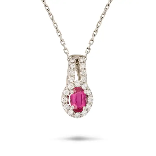HARLE PARIS, AN UNHEATED RUBY AND DIAMOND PENDANT NECKLACE in platinum, the pendant set with an oval