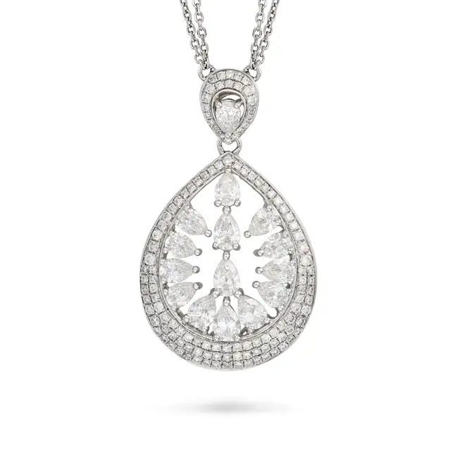 A DIAMOND PENDANT NECKLACE in 18ct white gold, the openwork pendant set with pear brilliant cut
