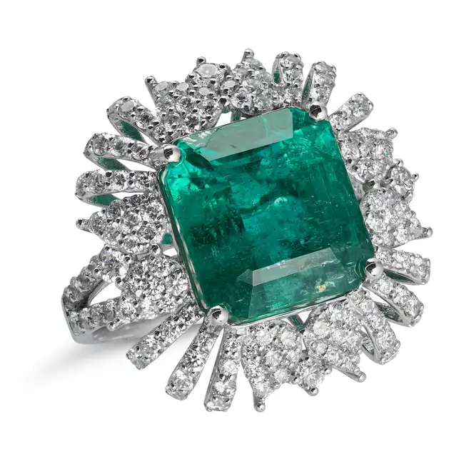 OSCAR FRIEDMAN, AN EMERALD AND DIAMOND DRESS RING set with an octagonal step cut emerald of 9.23