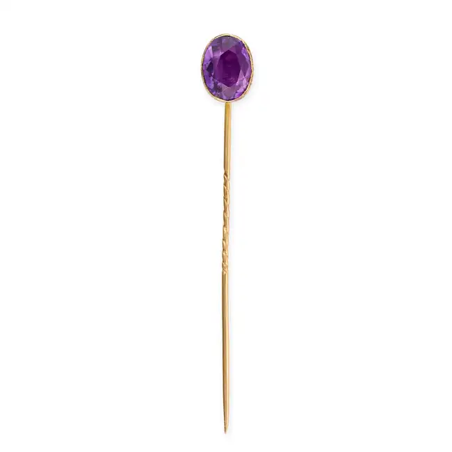 AN ANTIQUE AMETHYST STICK PIN set with an oval cut amethyst, no assay marks, 1.1cm, 2.1g.