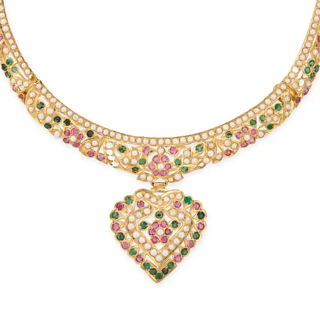 AN INDIAN PEARL, RUBY AND EMERALD HEART NECKLACE, EARRINGS AND RING SUITE the necklace comprising