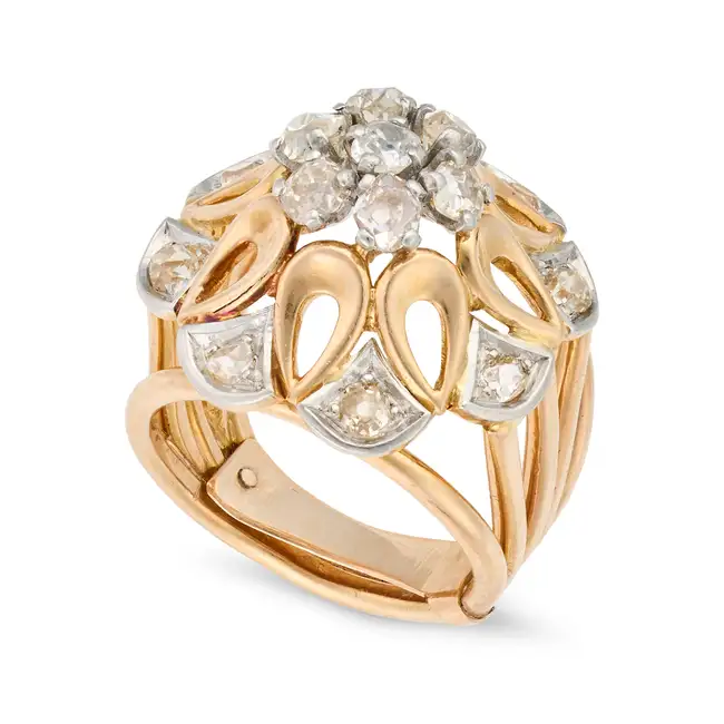 A VINTAGE FRENCH DIAMOND DRESS RING in 18ct yellow gold and platinum, designed as a stylised flower,