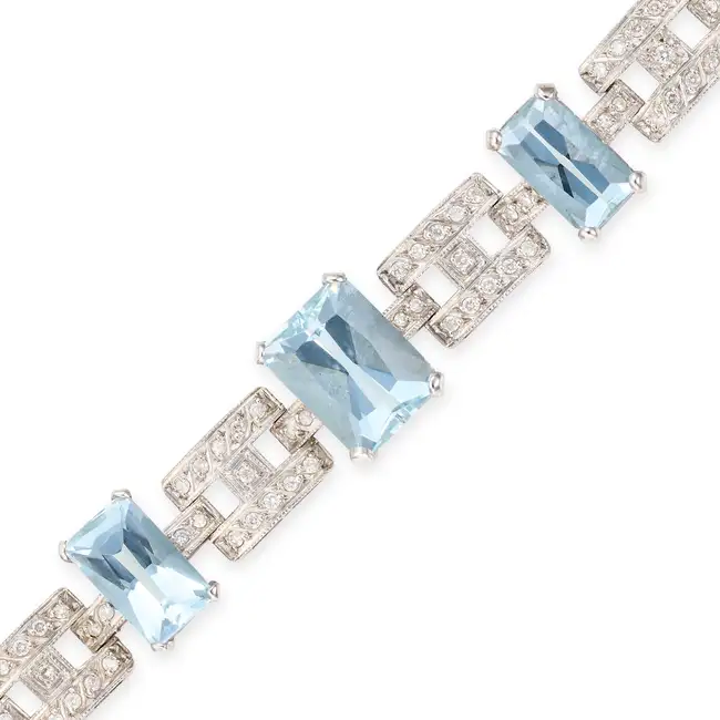 A VINTAGE AQUAMARINE AND DIAMOND BRACELET comprising a row of geometric links set with round
