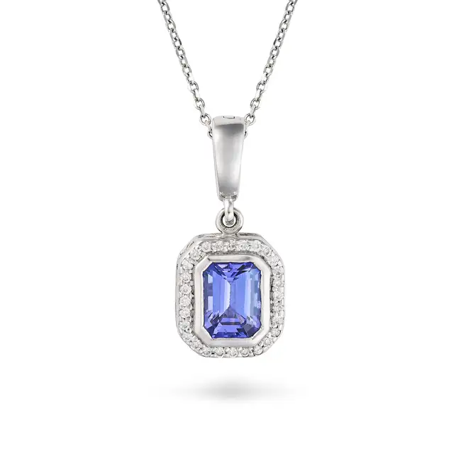 A TANZANITE AND DIAMOND PENDANT NECKLACE in 18ct white gold, the pendant set with an octagonal