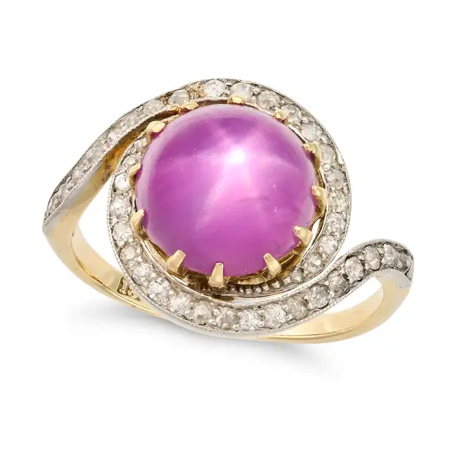 AN ANTIQUE CEYLON NO HEAT PINK STAR SAPPHIRE AND DIAMOND RING, EARLY 20TH CENTURY in 18ct yellow