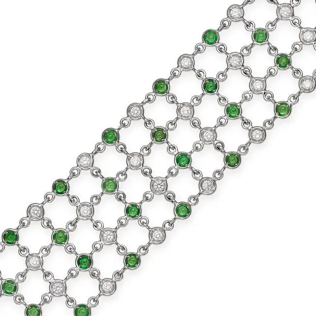 A TSAVORITE GARNET AND DIAMOND BRACELET in 18ct white gold, comprising lengths of chain set with