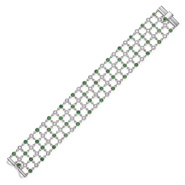 A TSAVORITE GARNET AND DIAMOND BRACELET in 18ct white gold, comprising lengths of chain set with