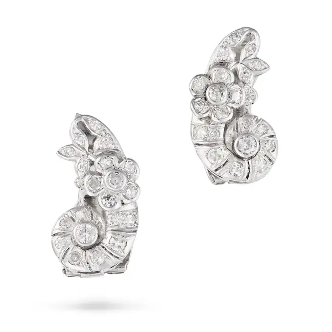 A PAIR OF VINTAGE DIAMOND CLIP EARRINGS each designed as a scroll with foliate decoration, set