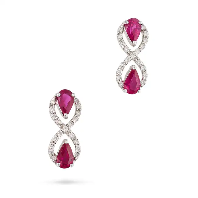 A PAIR OF RUBY AND DIAMOND EARRINGS in 18ct white gold, each designed as a figure of eight set