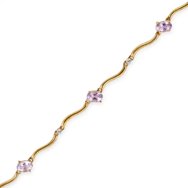 NO RESERVE - AN AMETHYST AND WHITE SAPPHIRE BRACELET in 9ct yellow gold, comprising a row of