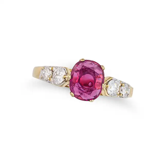 A RUBY AND DIAMOND RING in 14ct yellow gold, set with a cushion cut ruby of approximately 0.96