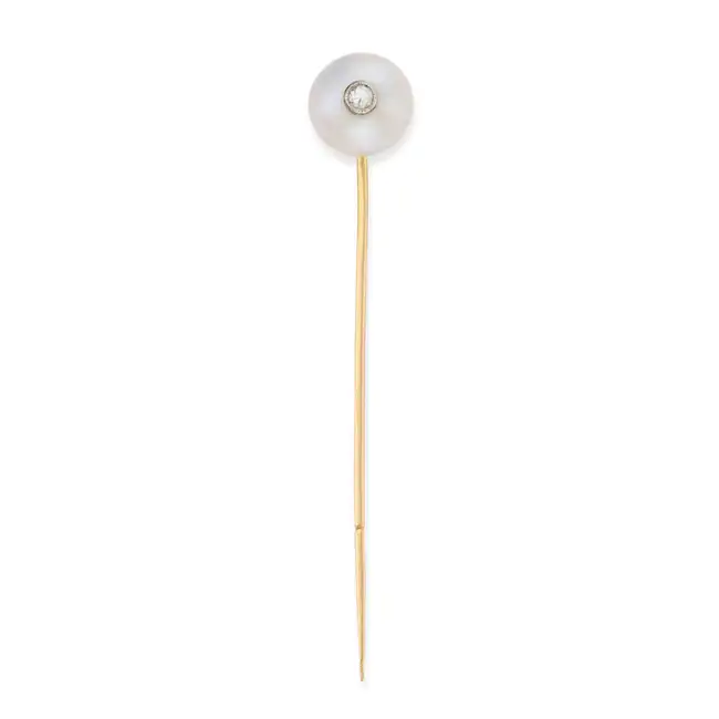 A PEARL AND DIAMOND STICK / TIE PIN comprising a pearl of 11.4mm set with a round brilliant cut