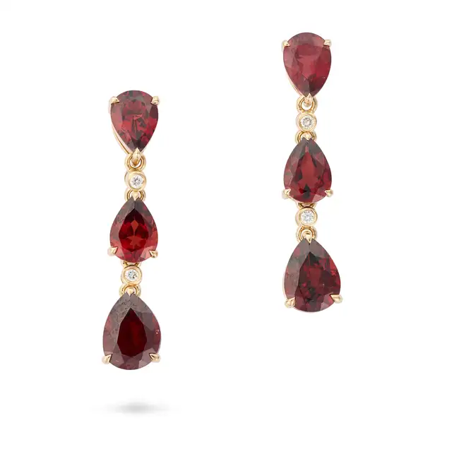 A PAIR OF GARNET AND DIAMOND DROP EARRINGS each comprising a row of pear cut garnets and round