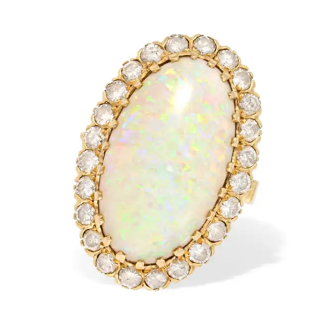 NO RESERVE - A VINTAGE OPAL AND DIAMOND COCKTAIL RING in 18ct yellow gold, set with a large oval
