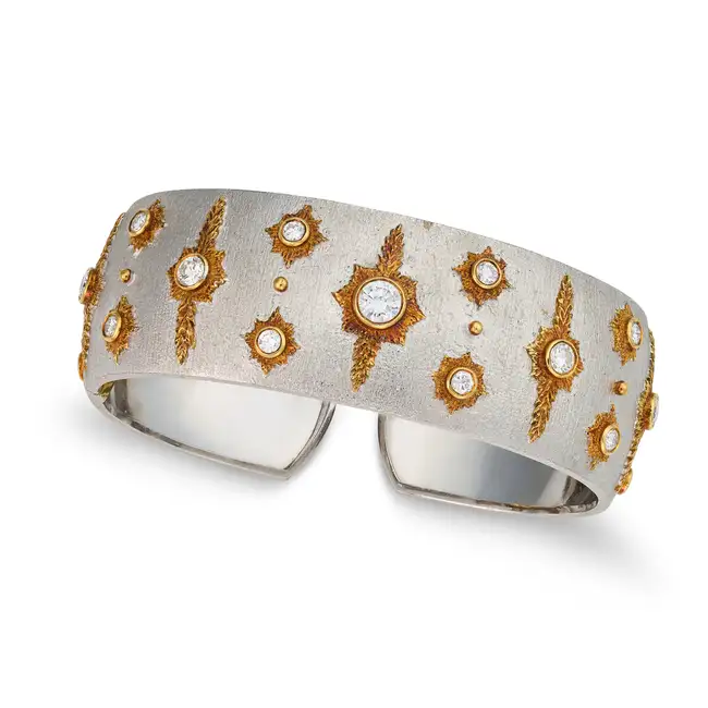 A FINE DIAMOND BANGLE the hinged open cuff bangle with a brushed finish, set with round brilliant
