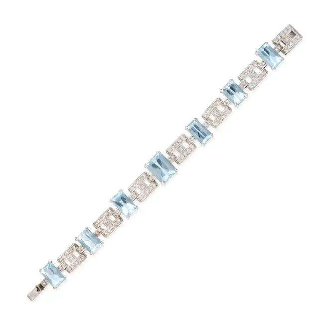 A VINTAGE AQUAMARINE AND DIAMOND BRACELET comprising a row of geometric links set with round