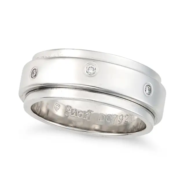 PIAGET, A DIAMOND POSSESSION SPINNING RING the central spinning band accented by round brilliant cut