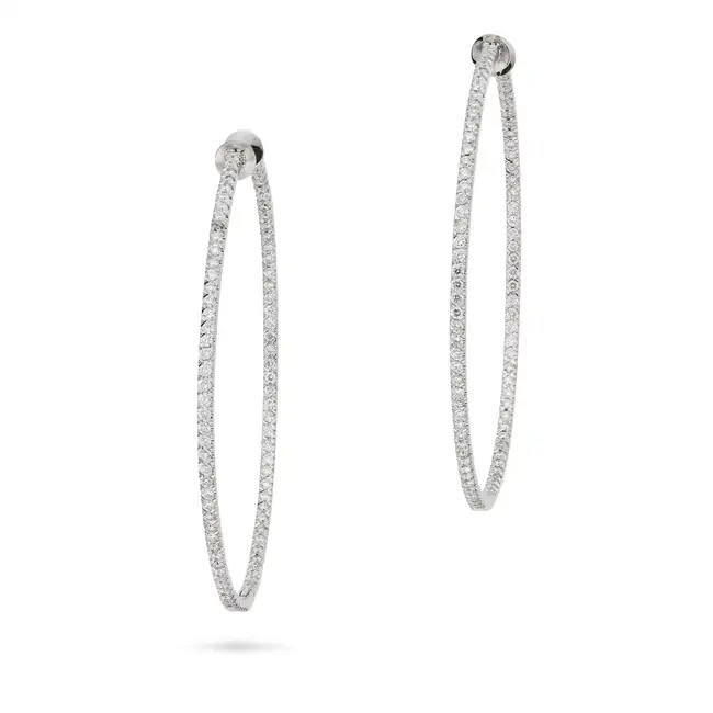 A PAIR OF DIAMOND HOOP EARRINGS each hoop set inside and out with a row of round brilliant cut
