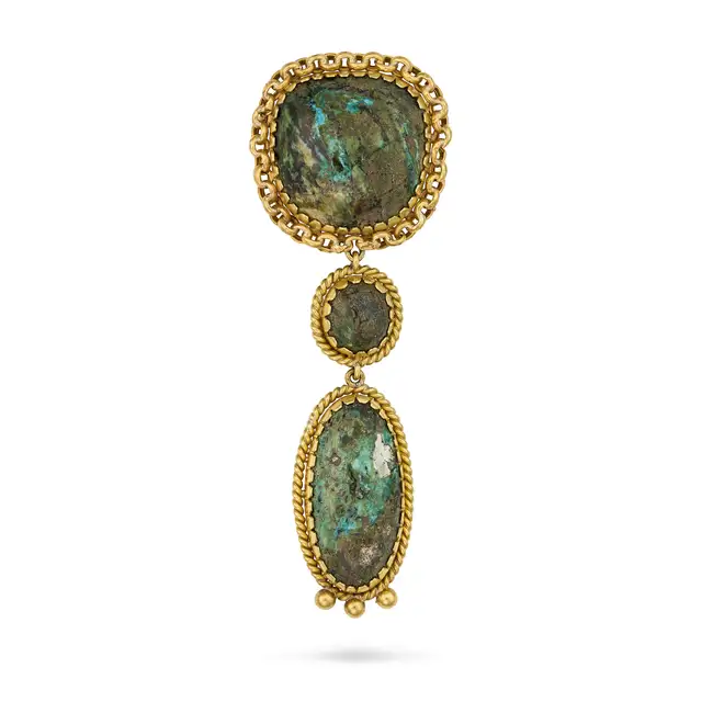 AN ANTIQUE HARDSTONE BROOCH, 19TH CENTURY set with three cabochon hardstones, within borders of