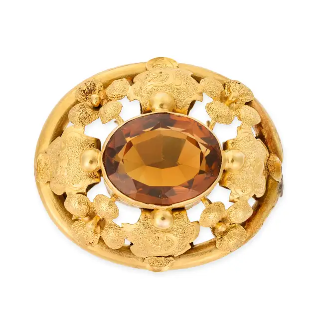 NO RESERVE - AN ANTIQUE CITRINE BROOCH, 19TH CENTURY set with an oval cut citrine, within an