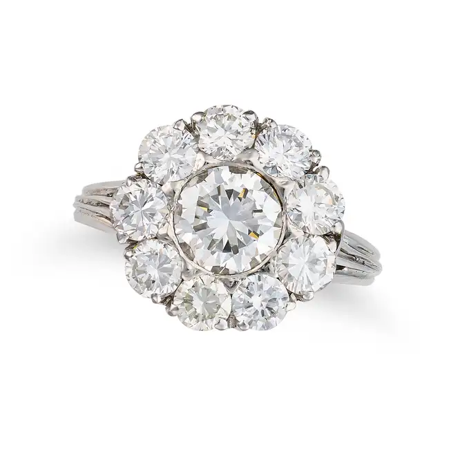 A FINE DIAMOND CLUSTER RING set with a round brilliant cut diamond of 1.13 carats in a cluster of