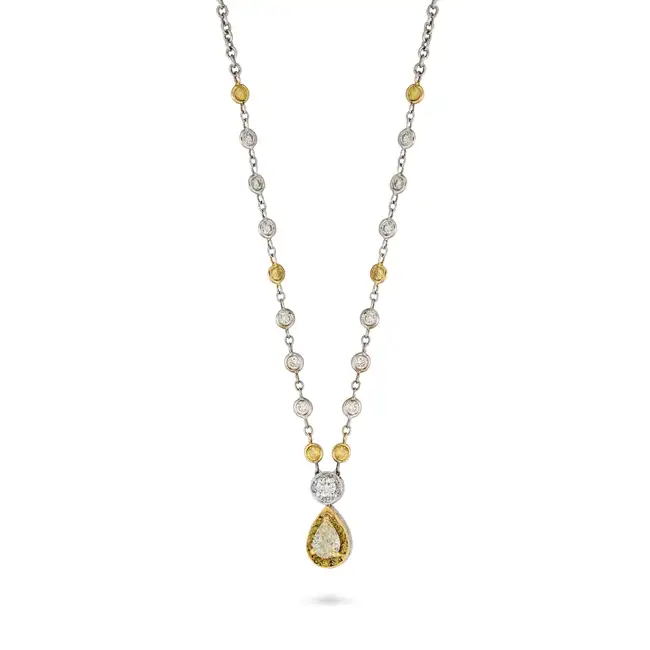 A YELLOW AND WHITE DIAMOND PENDANT NECKLACE in 18ct white and yellow gold, the pendant set with a